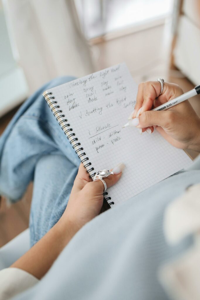 A man keeping his notes of the tasks of all day on a register